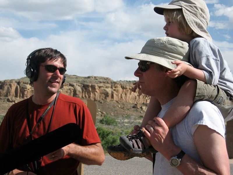 Richard Harris interviews climate scientist Jonathan Overpeck (carrying son Jack) in New Mexico’s Chaco Culture National Historic Park. Photo by Jane Greenhalgh/NPR.